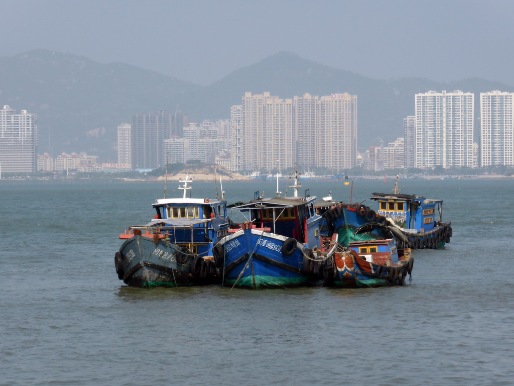 Boats in Xiamen Bay, Dayu Island and buildings at the Haicang district, viewed from the ferry to Gulangyu Island