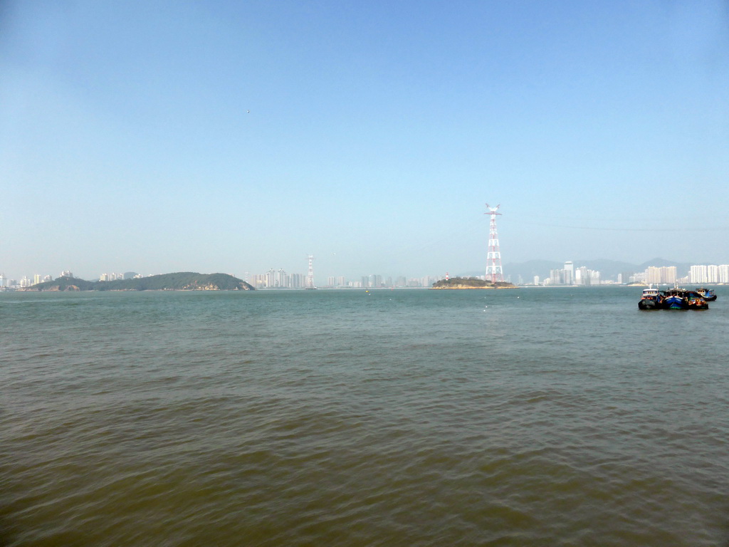 Boats in Xiamen Bay, Dayu Island and buildings at the Haicang district, viewed from the ferry to Gulangyu Island