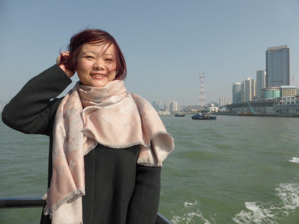 Miaomiao on the ferry to Gulangyu Island, with a view on Port nr. 1