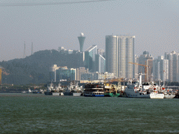The Huweishan Atmosphere Theme Park with its tower and boats in Xiamen Bay, viewed from the ferry to Gulangyu Island