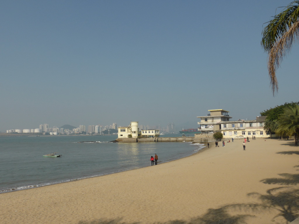 Buildings at the beach at the west side of Gulangyu Island, Xiamen Bay and skyscrapers at the Haicang district