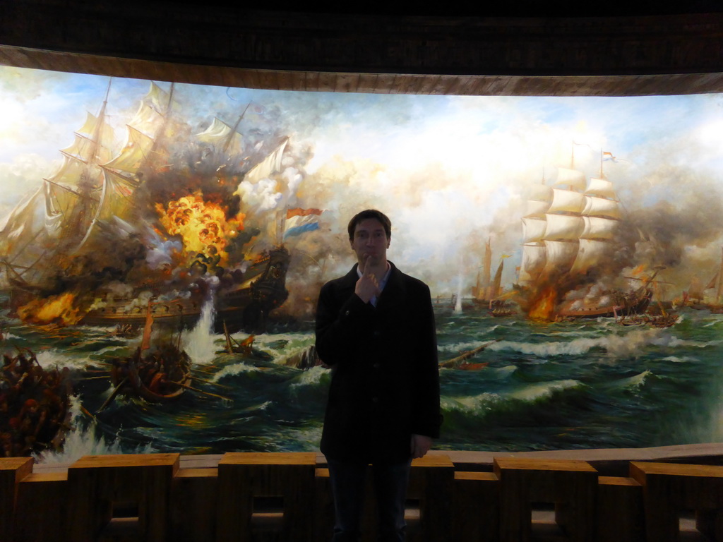 Tim with a painting of the naval battle between Zheng Chenggong and the Dutch, at the upper floor of the Zheng Chenggong Memorial Hall at Gulangyu Island