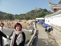 Miaomiao at Gangzaihou Beach at Gulangyu Island, with a view on Sunshine Rock