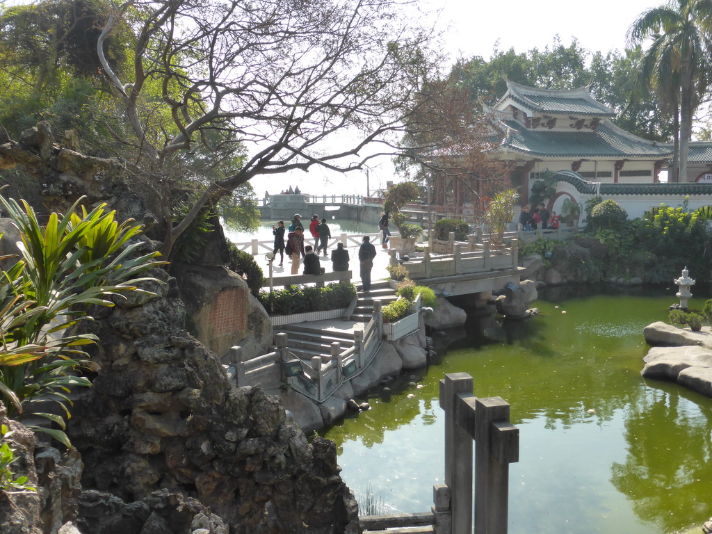 Miaomiao sitting in front of the Twelve Grotto Heaven at Gulangyu Island