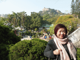 Miaomiao at the path to the Piano Museum at Gulangyu Island, with a view on the Shan Pavilion, the Twelve Grotto Heaven and Sunshine Rock