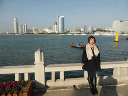 Miaomiao at Longtou Road at Gulangyu Island, with a view on skyscrapers at the west side of Xiamen Island and Xiamen Bay