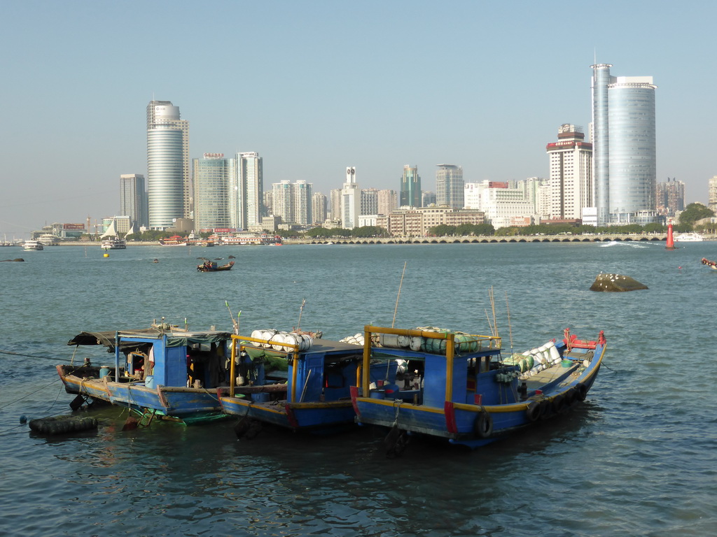 Boats in Xiamen Bay and skyscrapers at the west side of Xiamen Island, viewed from Yanping Road at Gulangyu Island