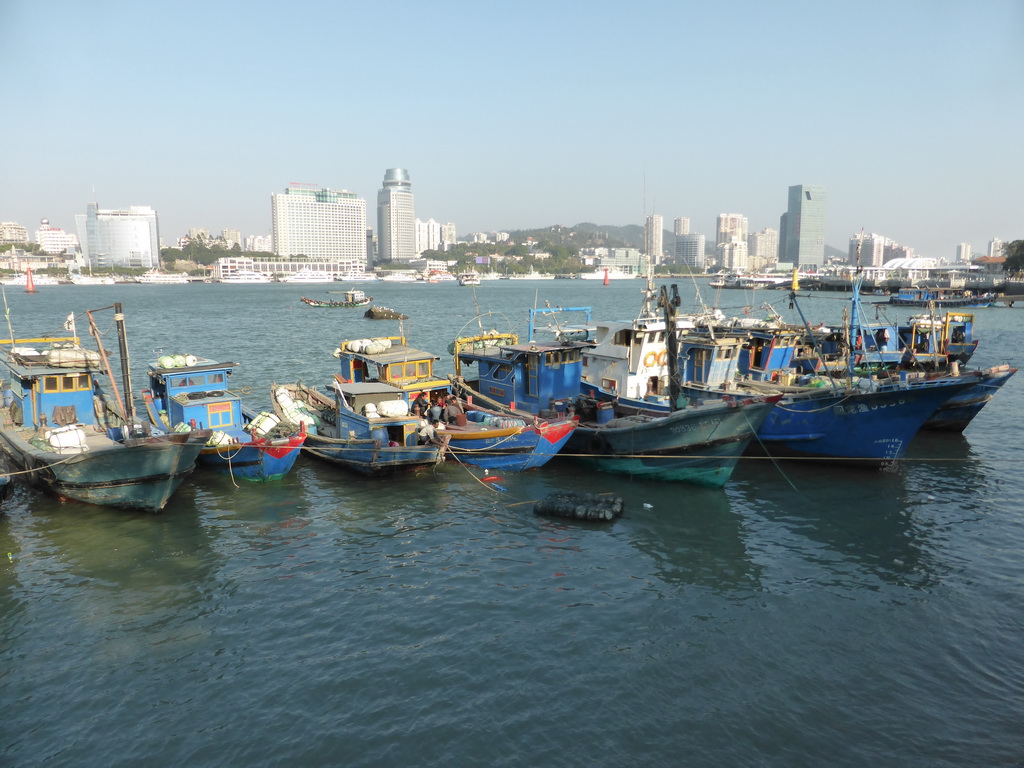 Boats in Xiamen Bay and skyscrapers at the west side of Xiamen Island, viewed from Yanping Road at Gulangyu Island