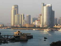 Skyscrapers at the west side of Xiamen Island, Xiamen Bay and a pier with pavilion, viewed from Fuding Rock at the Haoyue Park at Gulangyu Island