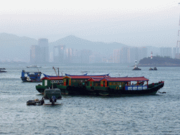 Boats in Xiamen Bay and skyscrapers at the Haicang District, viewed from the ferry from Gulangyu Island