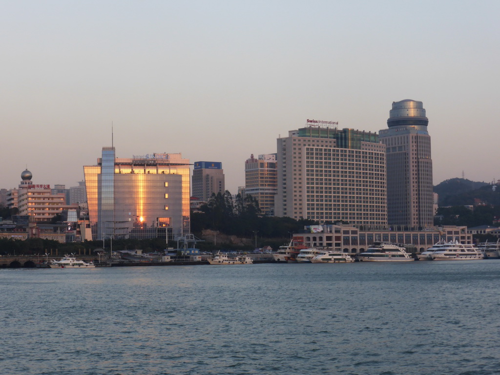 Boats in Xiamen Bay and skyscrapers at the west side of Xiamen Island, viewed from the ferry from Gulangyu Island