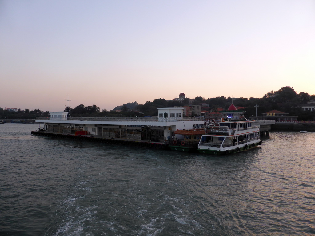 Xiamen Bay and the San Qiu Tian Ferry Terminal, the dome of the Gulangyu Organ Museum and Sunlight Rock at Gulangyu Island, viewed from the ferry to Xiamen Island