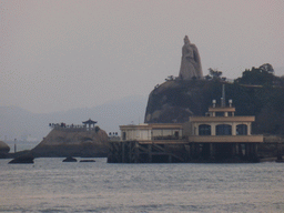 The large statue of Zheng Chenggong on Fuding Rock at the Haoyue Park and a pier with pavilion at Gulangyu Island, viewed from Lujiang Road