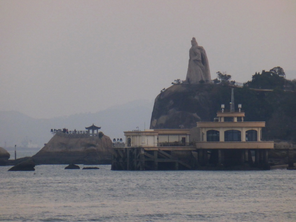 The large statue of Zheng Chenggong on Fuding Rock at the Haoyue Park and a pier with pavilion at Gulangyu Island, viewed from Lujiang Road