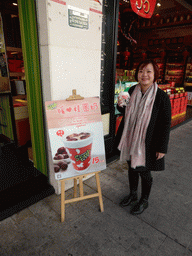 Miaomiao with a drink in front of the Funnew Spot bar at the Zhongshan Road Pedestrian Street