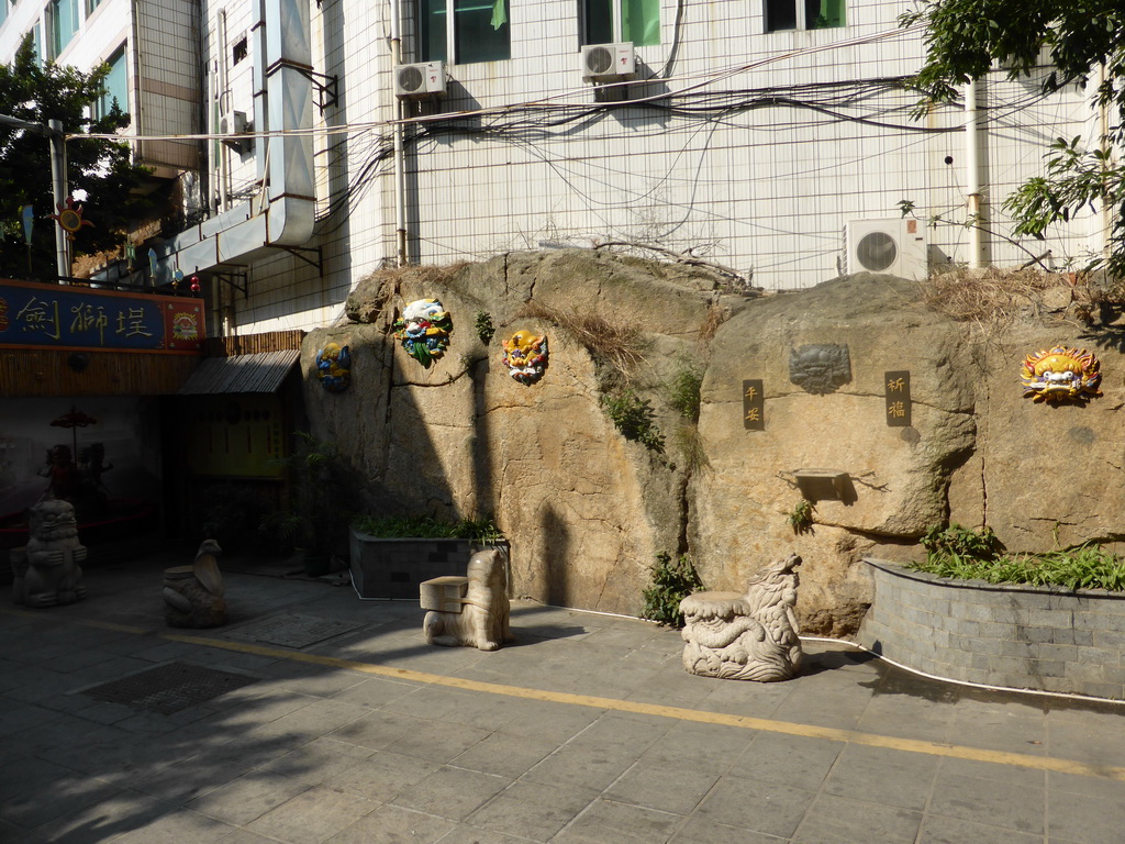 Masks on a wall at the Mintai Characteristic Food Street