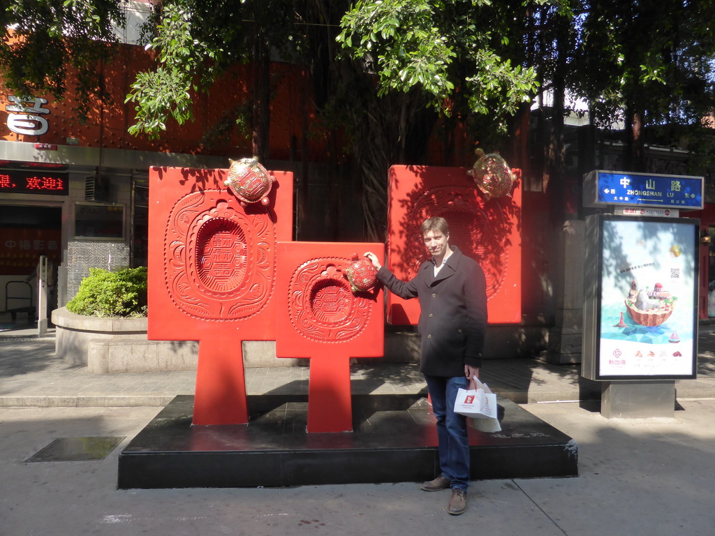 Tim with a piece of art at the Zhongshan Road Pedestrian Street