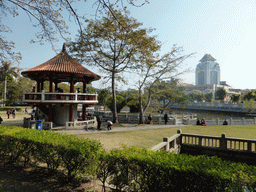 Pavilion and pool in the park in front of Nanputuo Temple and the tower of Xiamen University