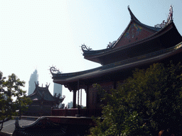 Rooftops of the Nanputuo Temple and two skyscrapers under construction