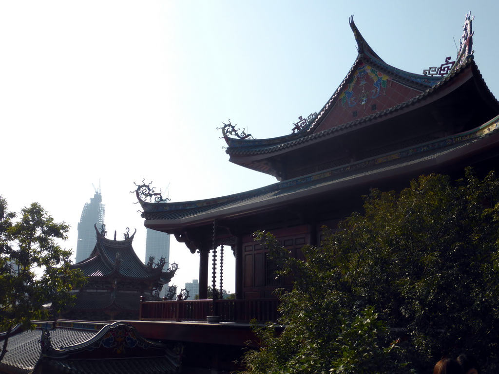 Rooftops of the Nanputuo Temple and two skyscrapers under construction