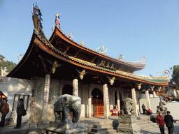 Elephant and lion statues in front of the Hall of Heavenly Kings of the Nanputuo Temple