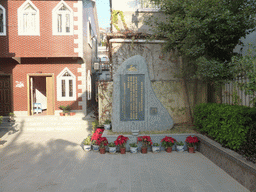 Shrine with flowers in front of the church at Zeng Cuo An Village