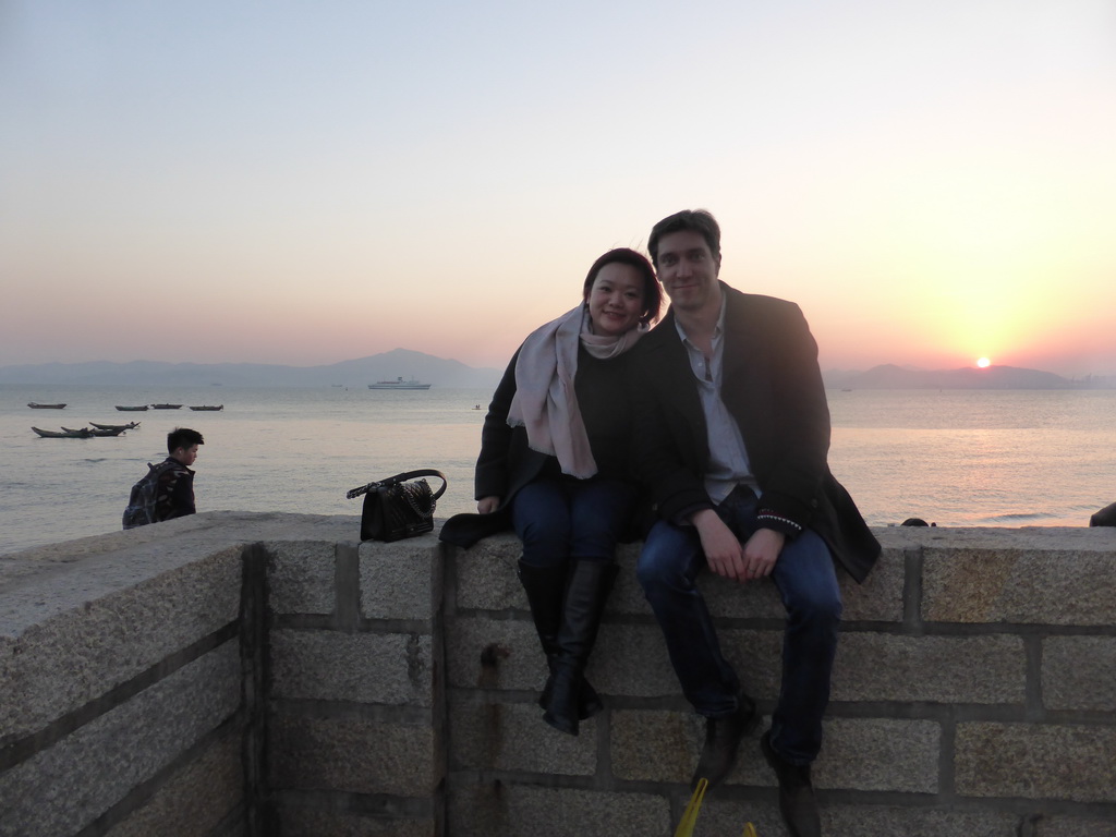 Tim and Miaomiao at the beach at Huandao South Road and the South China Sea, at sunset