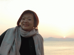 Miaomiao at the beach at Huandao South Road and the South China Sea, at sunset