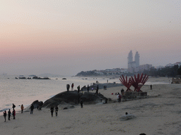 The beach at Huandao South Road, two skyscrapers under construction and the South China Sea