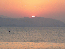 The Zhangzhou District and the South China Sea, viewed from the beach at Huandao South Road, at sunset