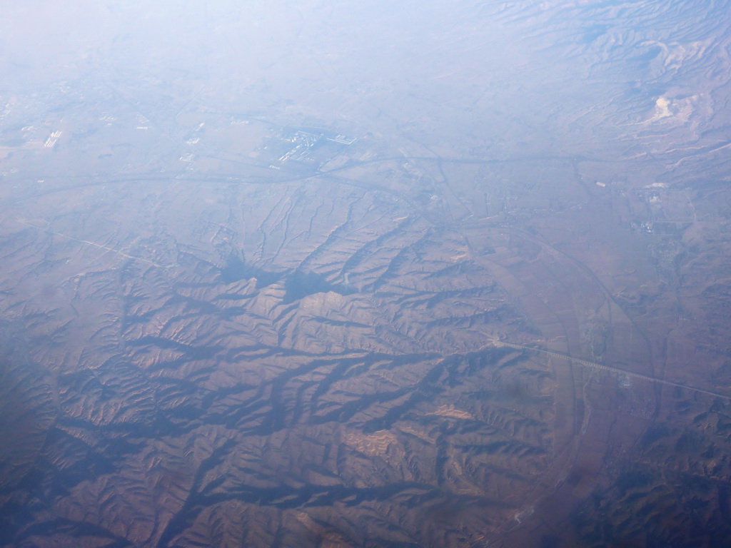 Hills, villages and roads in West Asia, viewed from the airplane to Amsterdam