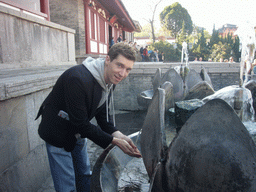 Tim with a fountain at the Huaqing Hot Springs