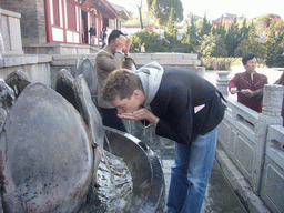 Tim and Miaomiao`s mother with a fountain at the Huaqing Hot Springs