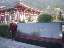 Miaomiao`s mother with a sign at the Huaqing Hot Springs