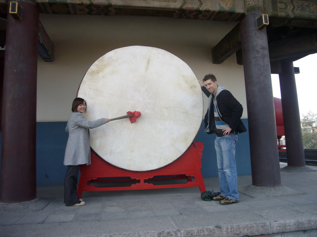 Tim and Miaomiao with a drum at the Drum Tower of Xi`an