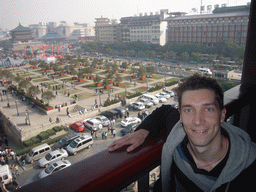 Tim at the Drum Tower of Xi`an, with a view on the Bell and Drum Tower Square with the Bell Tower of Xi`an