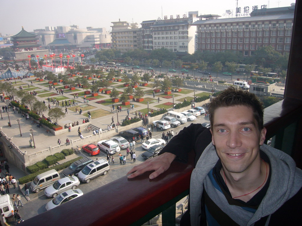 Tim at the Drum Tower of Xi`an, with a view on the Bell and Drum Tower Square with the Bell Tower of Xi`an