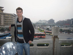 Tim at the Bell Tower of Xi`an, with a view on the Bell and Drum Tower Square with the Drum Tower of Xi`an