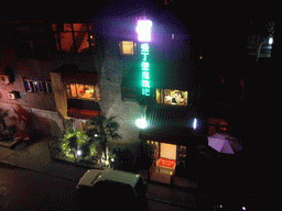 Front of a hotel in the city center, viewed from the top of the Xi`an City Wall, by night