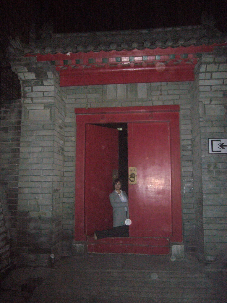 Miaomiao at a gate to the Xi`an City Wall, by night
