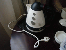 Water cooker with broken power cable in our room at a hotel in the city center