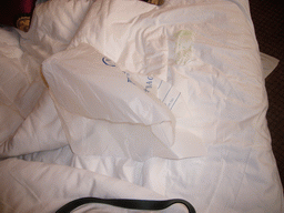 Laundry bag on the bed in our room at a hotel in the city center