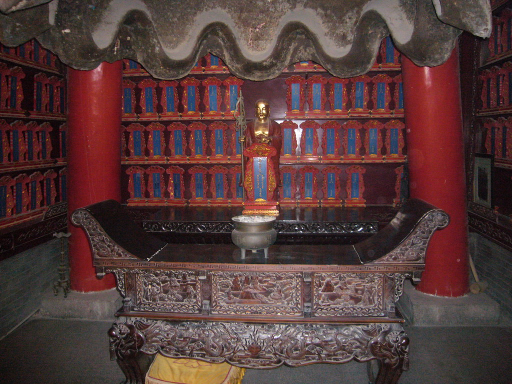 Buddha statue and altar in a building at the south side of the Daci`en Temple