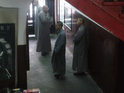 Buddhist monks at the ground floor of the Giant Wild Goose Pagoda at the Daci`en Temple