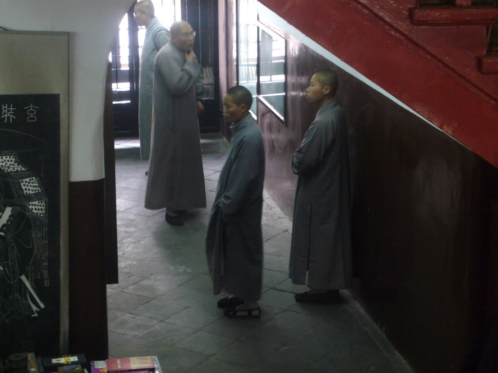 Buddhist monks at the ground floor of the Giant Wild Goose Pagoda at the Daci`en Temple
