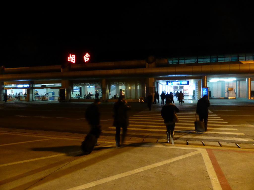 Miaomiao in front of Yantai Laishan International Airport, by night