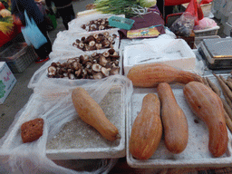 Vegetables and mushrooms at an open market in the city center