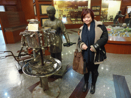 Miaomiao with a bottling machine at the ChangYu Wine Culture Museum