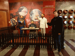 Tim with wax statues and information on the Underground Cellar, at the ChangYu Wine Culture Museum