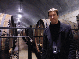 Tim with large wine barrels in the Underground Cellar at the ChangYu Wine Culture Museum